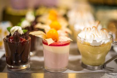 assorted dessert in small glass cups